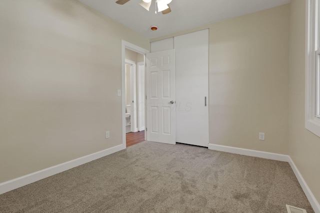 1614 Long St, Lancaster, OH 43130 - unfurnished bedroom with carpet flooring, a closet, and a ceiling fan