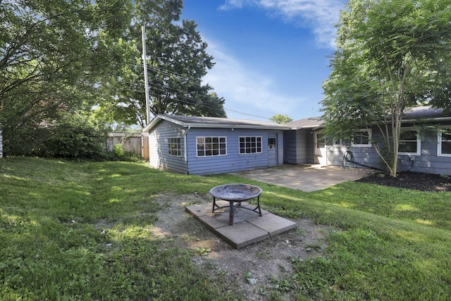 1614 Long St, Lancaster, OH 43130 - rear view of property featuring a patio area and an outdoor fire pit