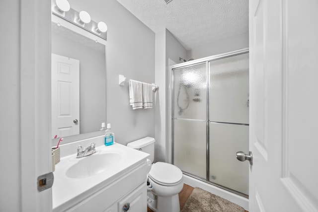 2986 E Powell Rd, Columbus, OH 43240 - full bathroom with vanity, a shower stall, and a textured ceiling
