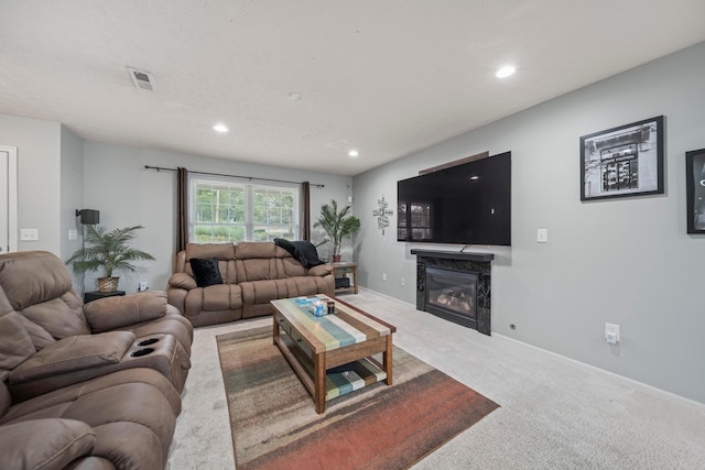 2986 E Powell Rd, Columbus, OH 43240 - living room featuring carpet, a glass covered fireplace, and recessed lighting