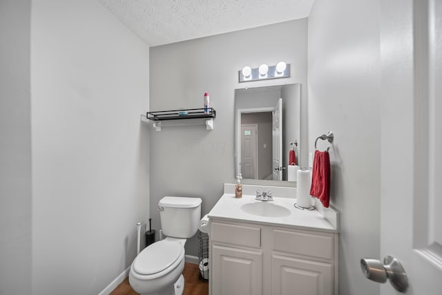 2986 E Powell Rd, Columbus, OH 43240 - half bathroom with vanity, a textured ceiling, and wood finished floors
