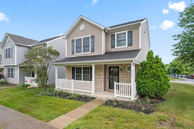 2986 E Powell Rd, Columbus, OH 43240 - view of front facade featuring a porch, stone siding, and a front yard