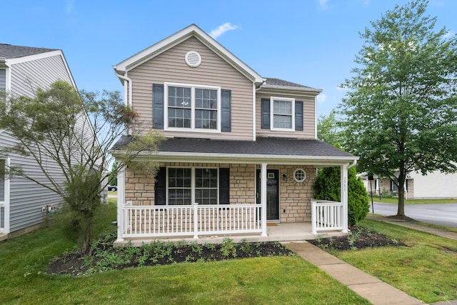 2986 E Powell Rd, Columbus, OH 43240 - traditional-style home featuring a porch, stone siding, and a front yard