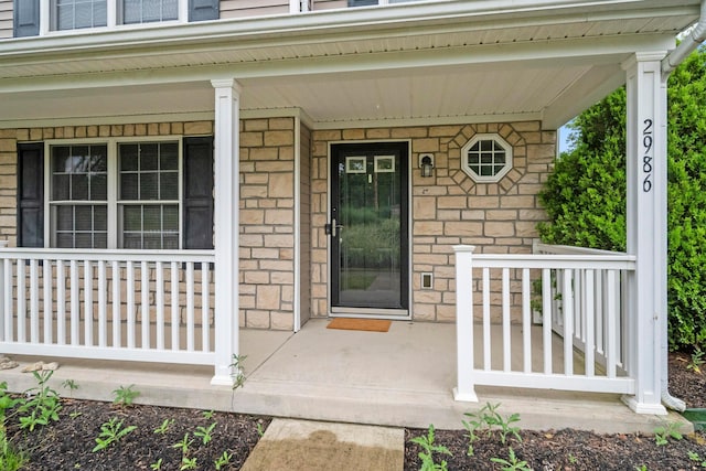 2986 E Powell Rd, Columbus, OH 43240 - property entrance featuring covered porch and stone siding