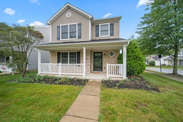 2986 E Powell Rd, Columbus, OH 43240 - traditional-style house with a porch and a front lawn