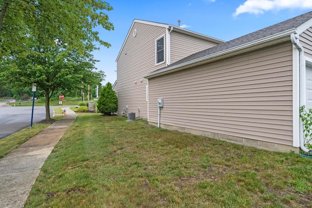 2986 E Powell Rd, Columbus, OH 43240 - view of side of home with a yard and a central AC unit