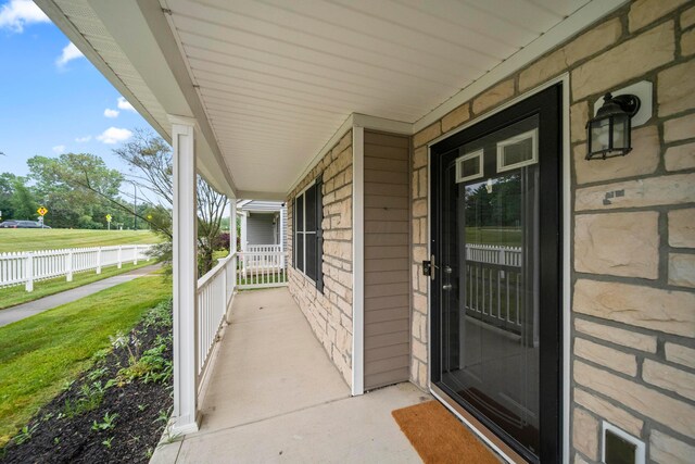 2986 E Powell Rd, Columbus, OH 43240 - view of exterior entry featuring covered porch and a lawn