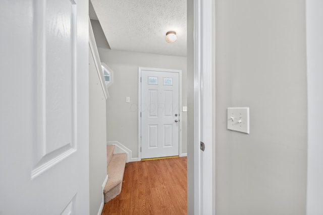 2986 E Powell Rd, Columbus, OH 43240 - corridor featuring light wood-style flooring and a textured ceiling