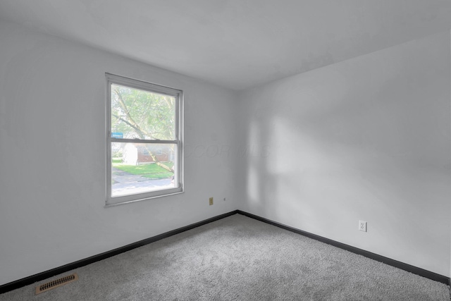 4974 Silverton Dr, Columbus, OH 43232 - spare room with carpet and baseboards