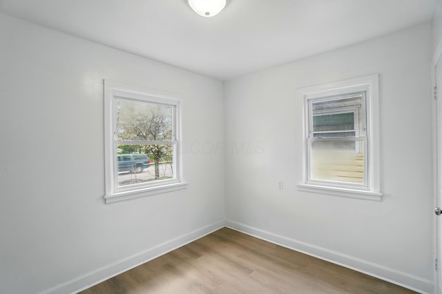 2678 Eakin Rd, Columbus, OH 43204 - unfurnished room with baseboards and wood finished floors