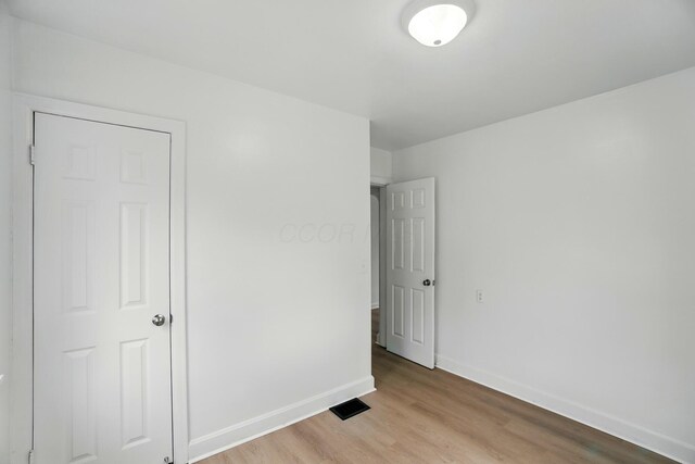 2678 Eakin Rd, Columbus, OH 43204 - unfurnished bedroom featuring baseboards and light wood-style flooring