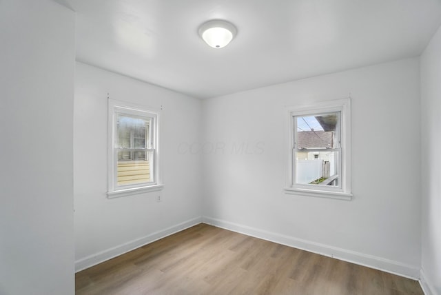 2678 Eakin Rd, Columbus, OH 43204 - spare room featuring wood finished floors and baseboards