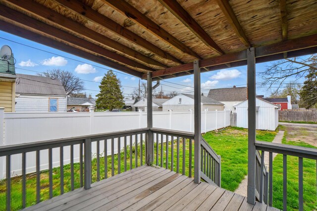2678 Eakin Rd, Columbus, OH 43204 - deck with a fenced backyard, a storage unit, and a residential view