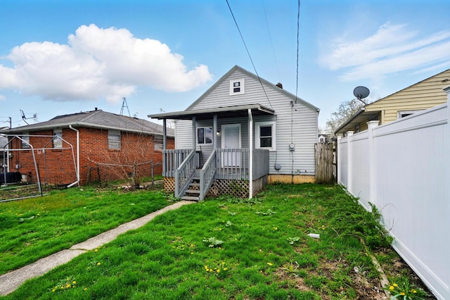 2678 Eakin Rd, Columbus, OH 43204 - back of property featuring a fenced backyard and a porch