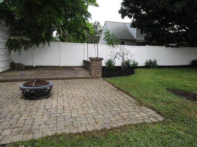 112 N Cherry St, Mount Gilead, OH 43338 - fenced backyard featuring an outdoor fire pit and a patio