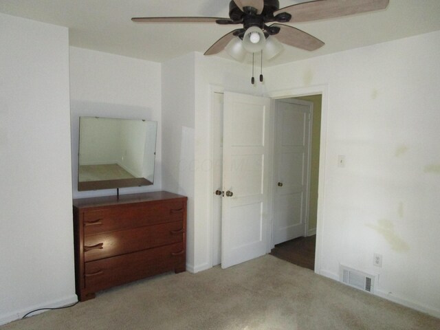 112 N Cherry St, Mount Gilead, OH 43338 - unfurnished bedroom featuring carpet flooring and a ceiling fan