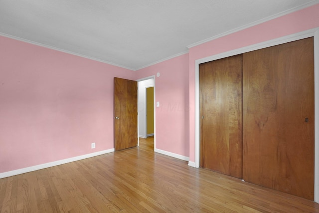 5335 Crawford Dr, Columbus, OH 43229 - unfurnished bedroom featuring wood finished floors, a closet, and ornamental molding
