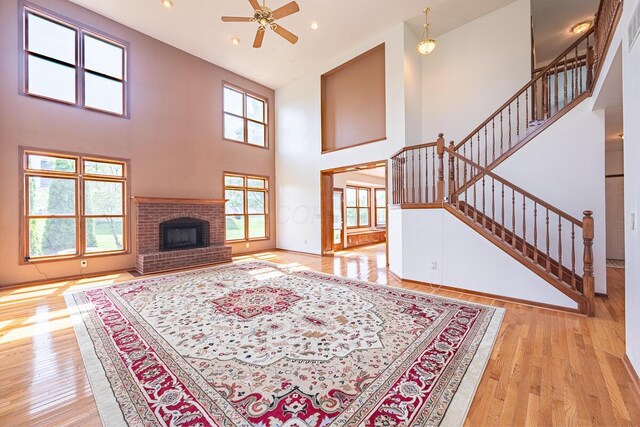 8510 Morgan St, Pickerington, OH 43147 - living room with ceiling fan, a high ceiling, light wood-style flooring, recessed lighting, and stairs