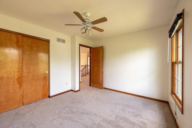 8510 Morgan St, Pickerington, OH 43147 - unfurnished bedroom featuring carpet floors, a closet, and a ceiling fan