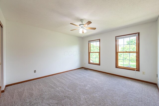 8510 Morgan St, Pickerington, OH 43147 - empty room featuring carpet, a ceiling fan, and a textured ceiling