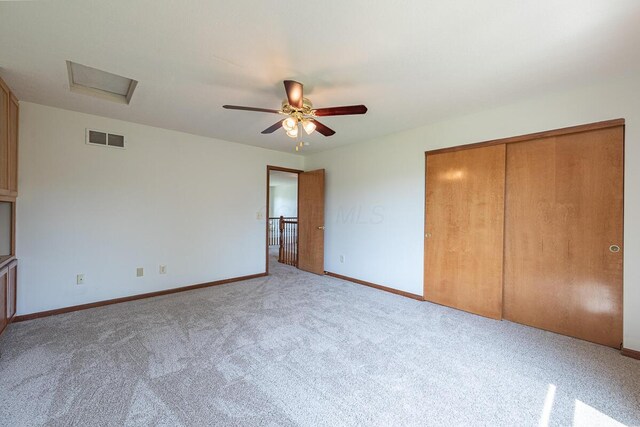 8510 Morgan St, Pickerington, OH 43147 - unfurnished bedroom featuring carpet, attic access, a closet, and a ceiling fan