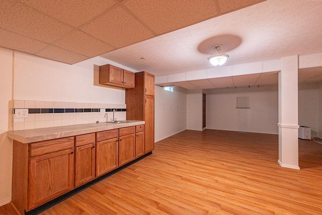 8510 Morgan St, Pickerington, OH 43147 - finished basement with light wood-style flooring and a paneled ceiling