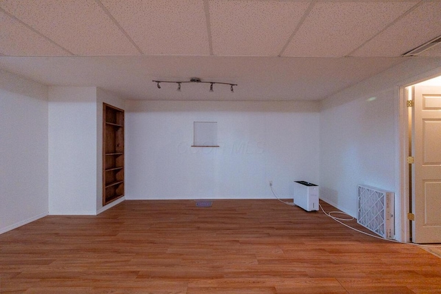 8510 Morgan St, Pickerington, OH 43147 - empty room with light wood-type flooring, track lighting, and built in features