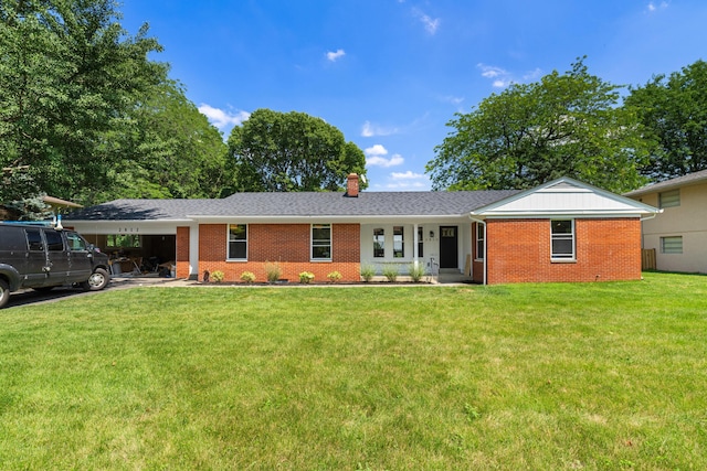 2812 N Star Rd, Columbus, OH 43221 - single story home featuring brick siding, an attached carport, a front lawn, a chimney, and driveway