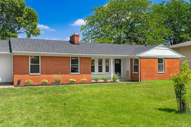 2812 N Star Rd, Columbus, OH 43221 - ranch-style house with brick siding, a chimney, a front lawn, and roof with shingles