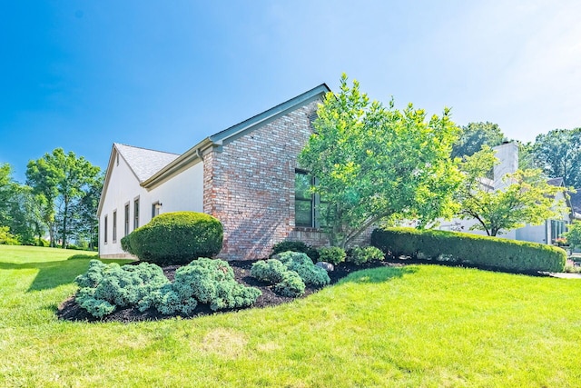 5608 Lynx Dr, Westerville, OH 43081 - view of home's exterior with a yard and brick siding