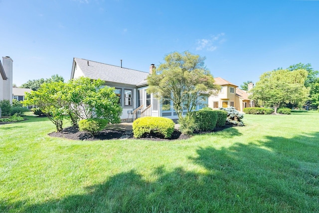 5608 Lynx Dr, Westerville, OH 43081 - rear view of house with a yard and a chimney
