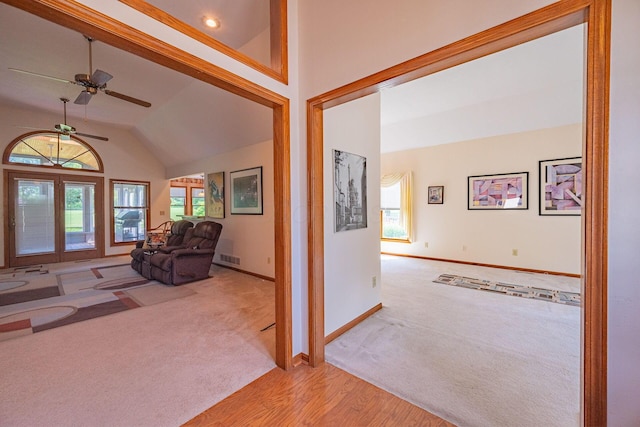 5608 Lynx Dr, Westerville, OH 43081 - carpeted living area with lofted ceiling, a ceiling fan, and wood finished floors