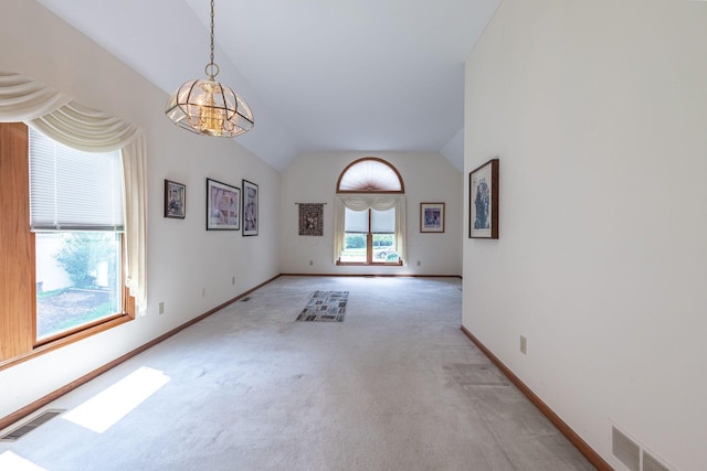 5608 Lynx Dr, Westerville, OH 43081 - unfurnished room featuring lofted ceiling, light colored carpet, and a chandelier
