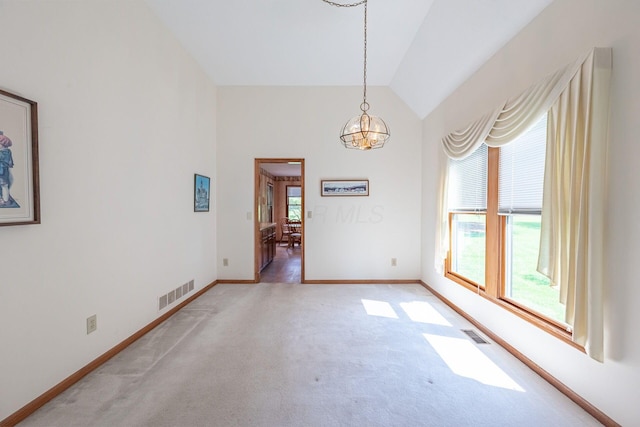 5608 Lynx Dr, Westerville, OH 43081 - spare room featuring light colored carpet, a chandelier, and vaulted ceiling