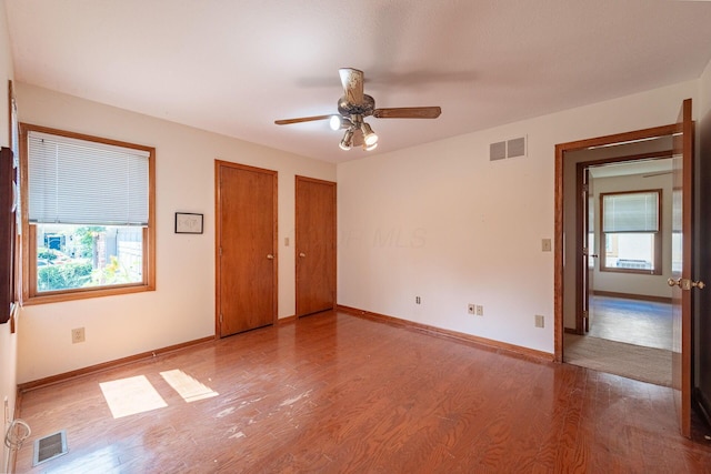 5608 Lynx Dr, Westerville, OH 43081 - empty room with wood finished floors, healthy amount of natural light, and a ceiling fan
