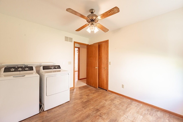 5608 Lynx Dr, Westerville, OH 43081 - laundry room featuring washer and clothes dryer, light wood-type flooring, and a ceiling fan