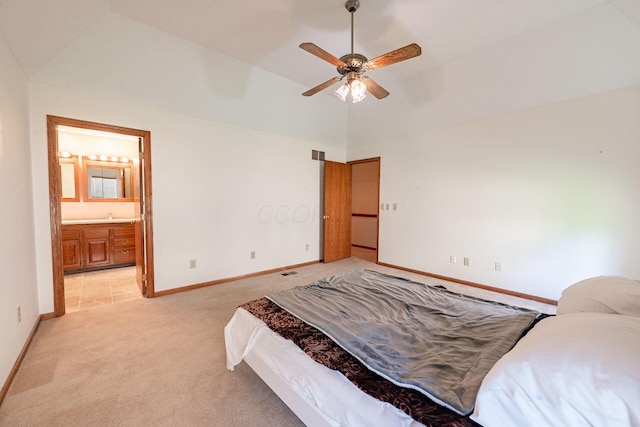 5608 Lynx Dr, Westerville, OH 43081 - bedroom with light colored carpet, vaulted ceiling, connected bathroom, and ceiling fan