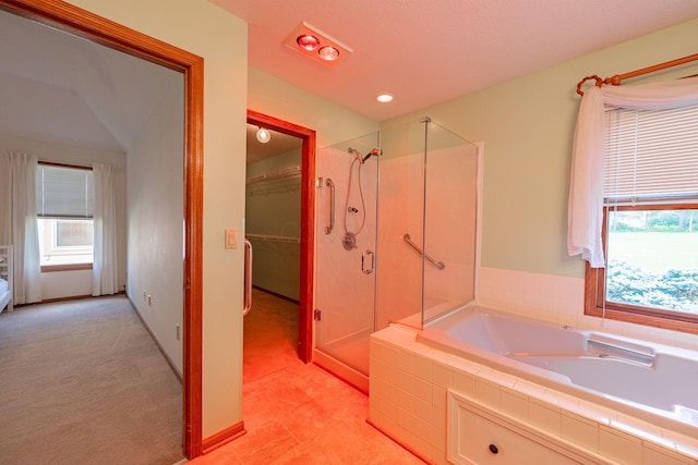 5608 Lynx Dr, Westerville, OH 43081 - full bathroom with a stall shower, a garden tub, a walk in closet, and tile patterned floors