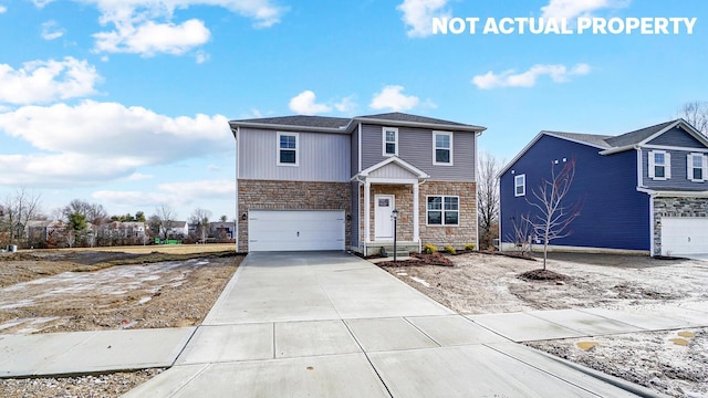1415 Gimbles Dr, Columbus, OH 43223 - view of front facade featuring stone siding, a garage, and driveway