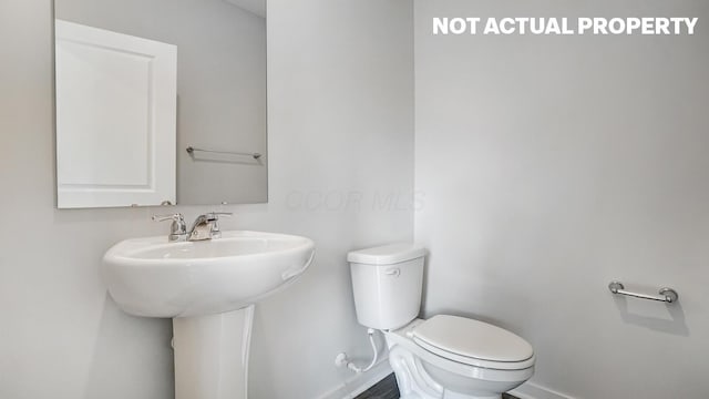 1415 Gimbles Dr, Columbus, OH 43223 - half bath with baseboards and toilet