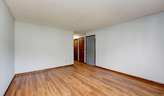 2761-2763 Blendon Woods Blvd, Columbus, OH 43231 - empty room with light wood-style flooring and a textured ceiling