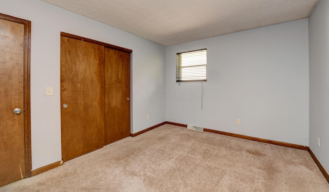 2761-2763 Blendon Woods Blvd, Columbus, OH 43231 - unfurnished bedroom with carpet flooring, a textured ceiling, and a closet