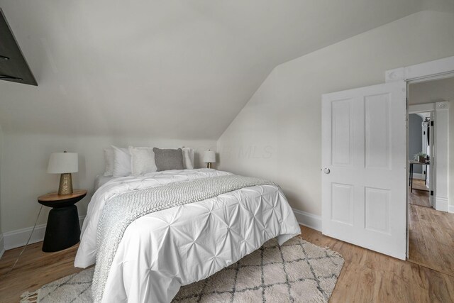442 Thurman Ave, Columbus, OH 43206 - bedroom with lofted ceiling and wood finished floors