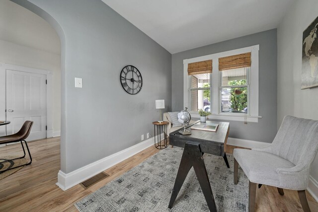 442 Thurman Ave, Columbus, OH 43206 - home office featuring arched walkways, vaulted ceiling, and wood finished floors