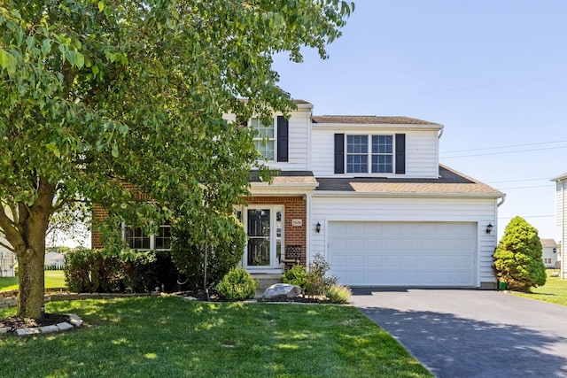 1626 Geranium Dr, Lewis Center, OH 43035 - view of front of house with concrete driveway, a front yard, an attached garage, and a shingled roof