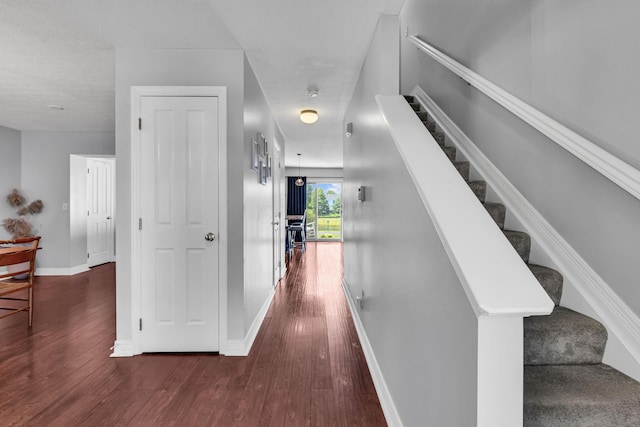 1626 Geranium Dr, Lewis Center, OH 43035 - hallway with dark wood finished floors and stairs