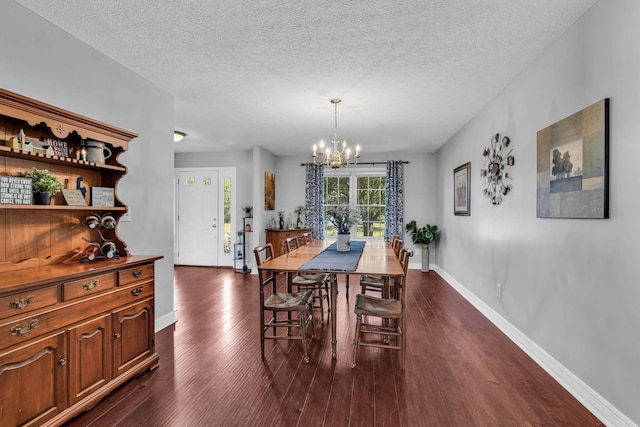 1626 Geranium Dr, Lewis Center, OH 43035 - dining space featuring dark wood-style floors, a chandelier, and a textured ceiling