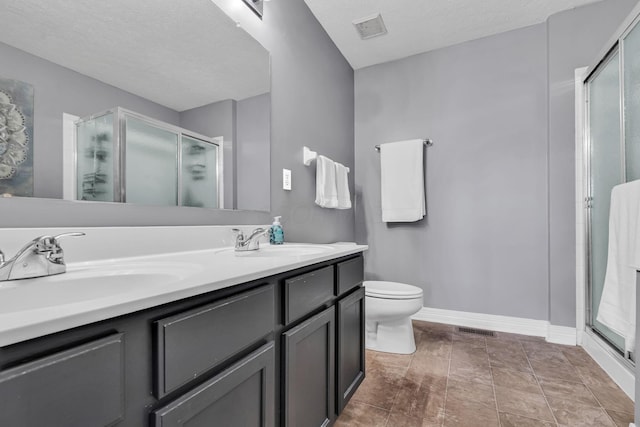 1626 Geranium Dr, Lewis Center, OH 43035 - full bath featuring a shower stall, double vanity, and a textured ceiling