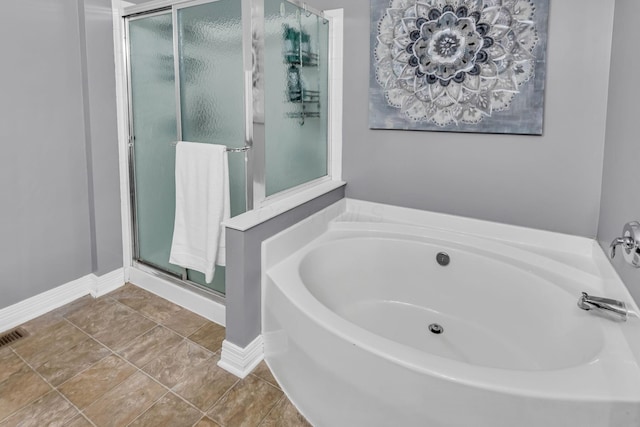 1626 Geranium Dr, Lewis Center, OH 43035 - bathroom featuring a stall shower and a garden tub
