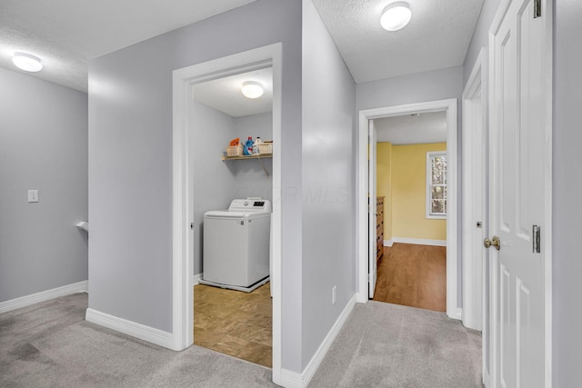 1626 Geranium Dr, Lewis Center, OH 43035 - hall with washer / clothes dryer, a textured ceiling, and carpet flooring